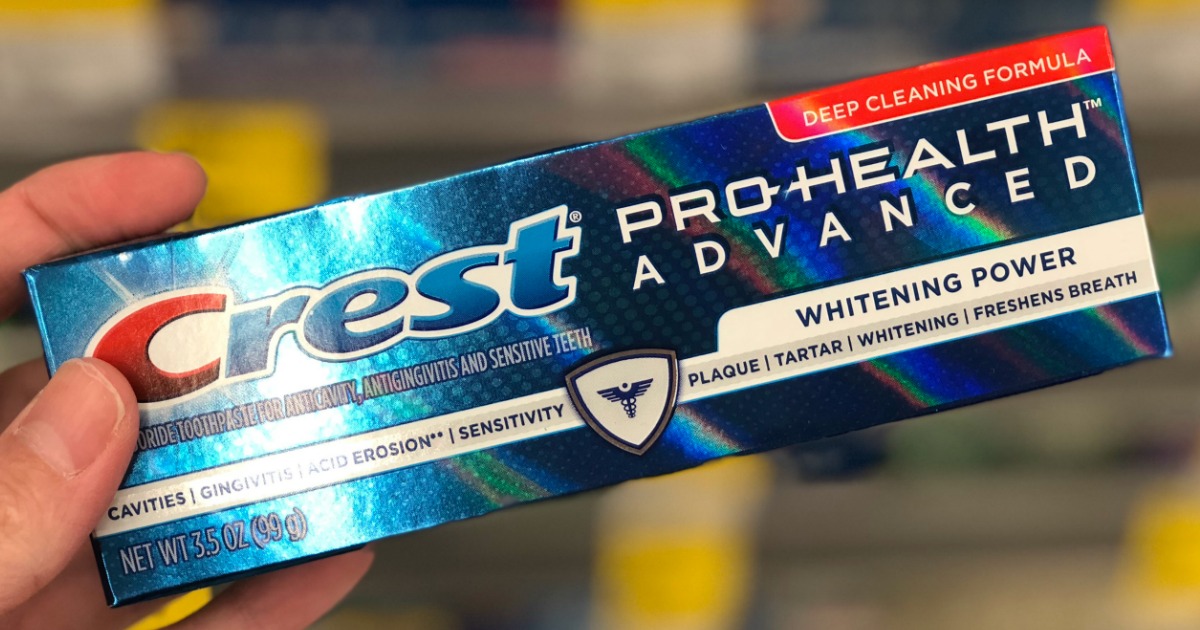 hand holding up box of crest pro health toothpaste