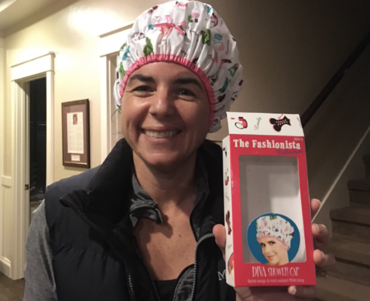women wearing shower cap and holding packaging