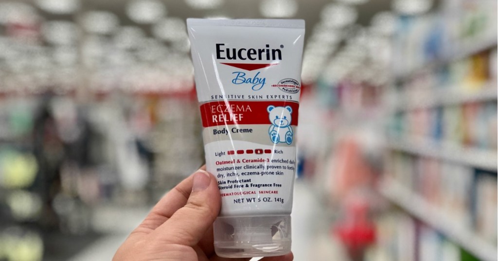 hand holding eucerin baby eczema relief in store 