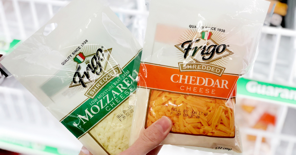 Manicured Hand holding frigo mozzarella and Frigo Cheddar Shredded cheeses