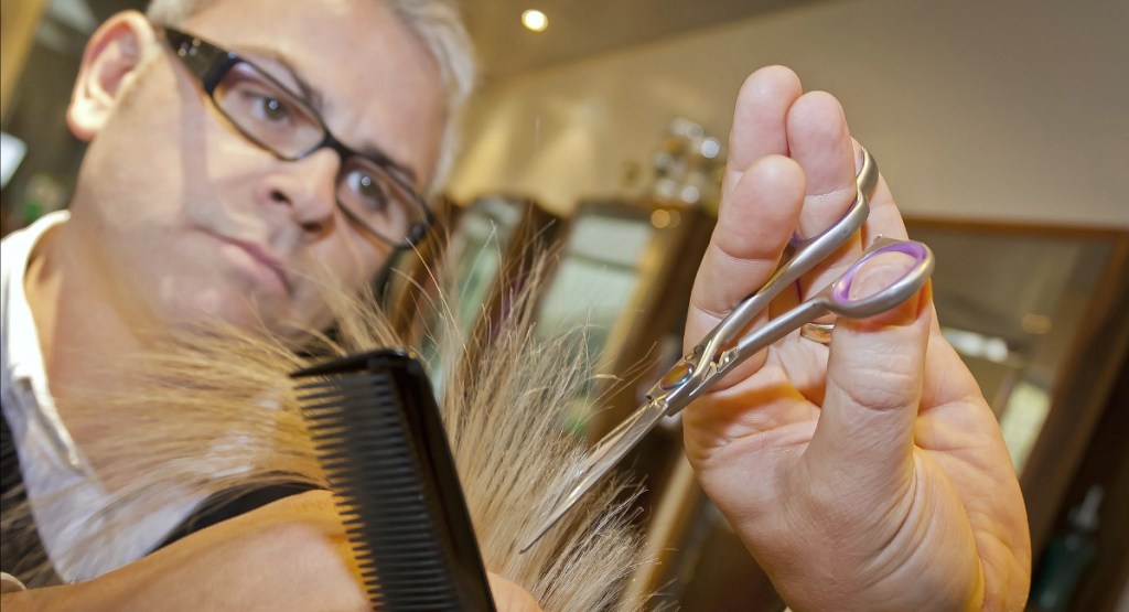 hair stylist trimming hair