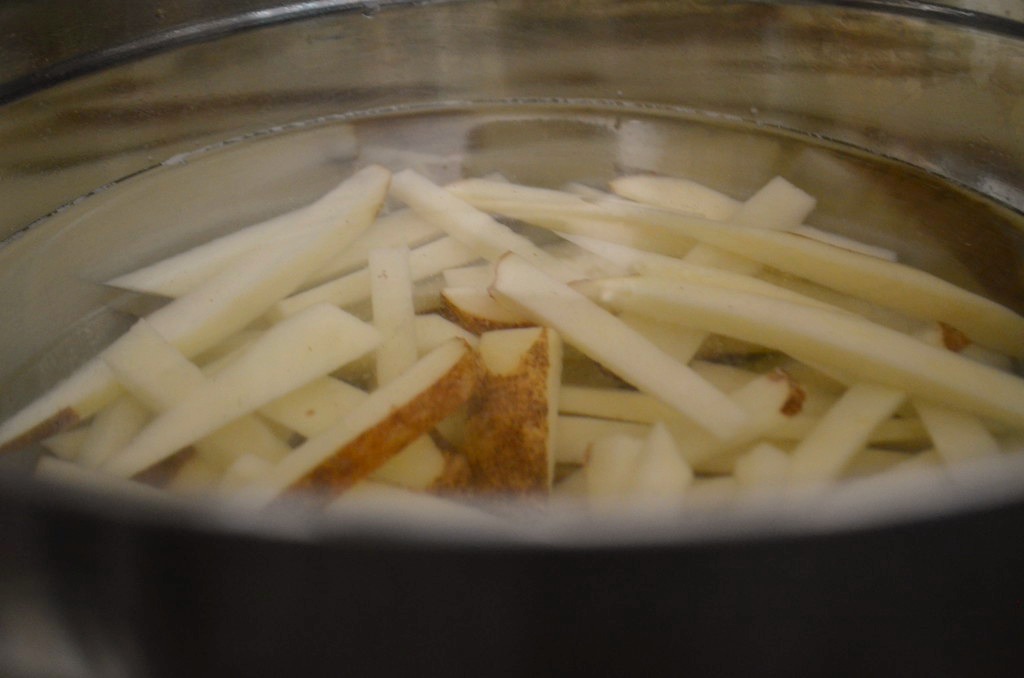 Soak the potatoes to soften them before placing them in the air fryer.