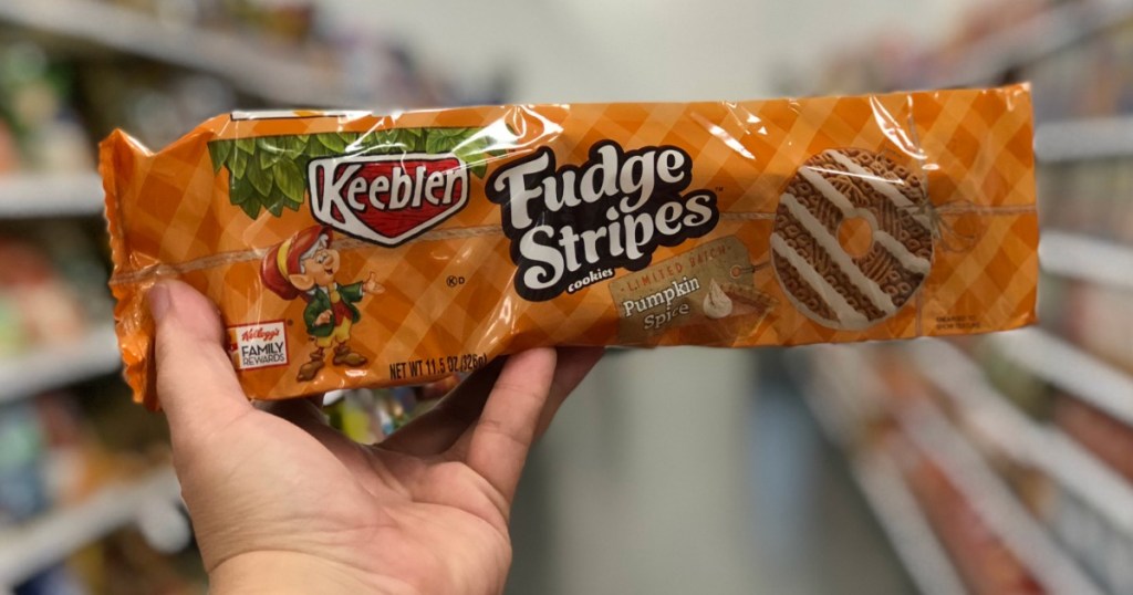 holding a package of Keebler fudge stripe cookies