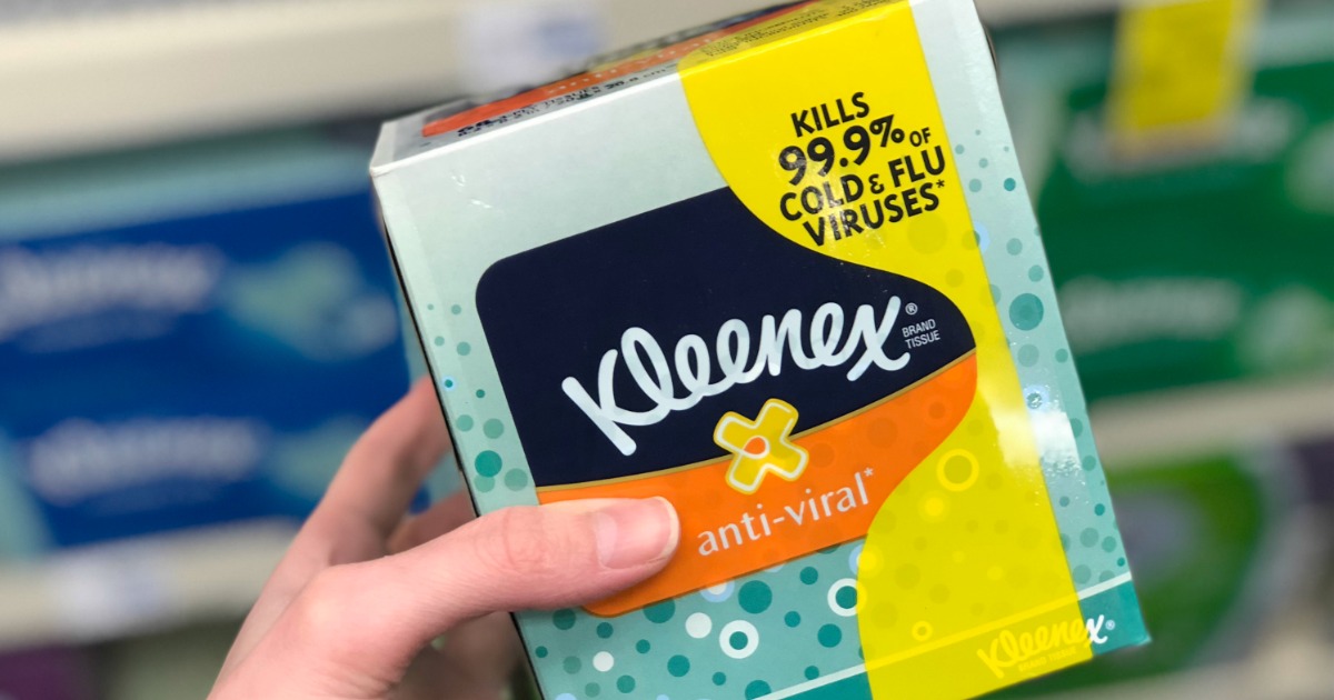 hand holding a box of Kleenex Anti-Viral Facial Tissues 60ct Box