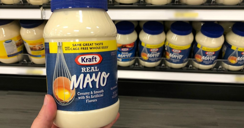 Hand holding a bottle of Kraft mayo