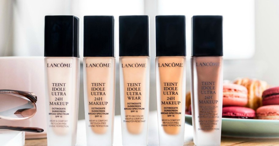 multiple bottles of lancome foundation in a row