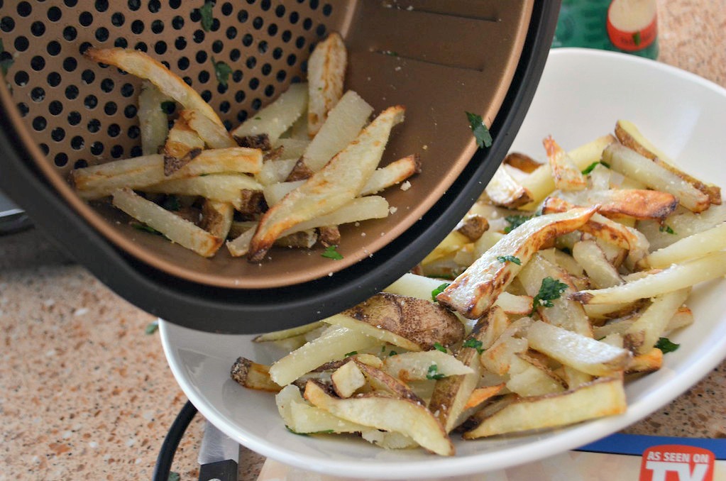 Tossed with Parmesan cheese and herbs, these air fryer french fries look as good as they taste.