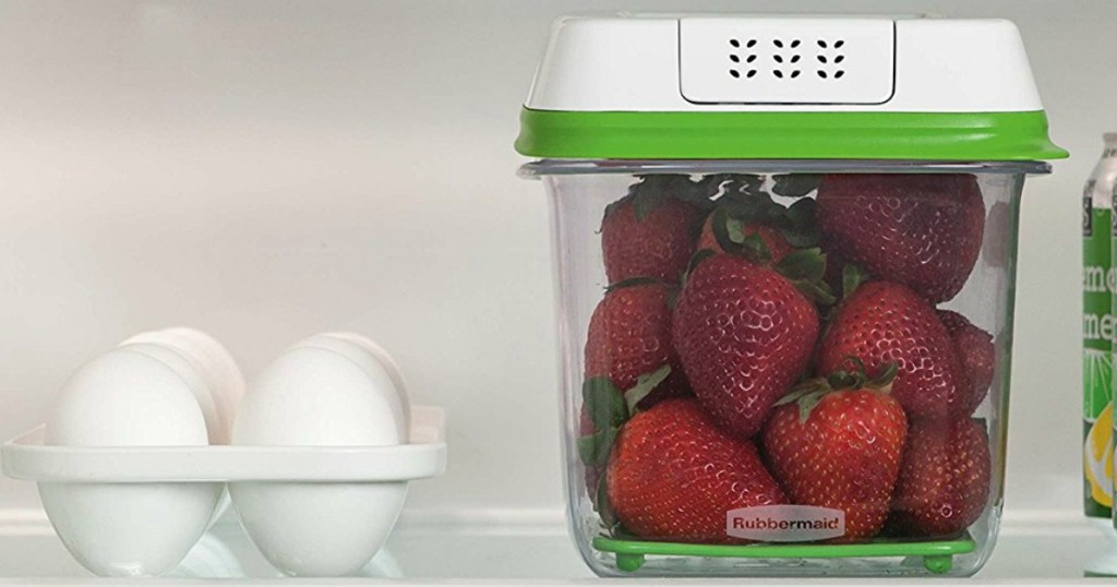 container with strawberries in the fridge