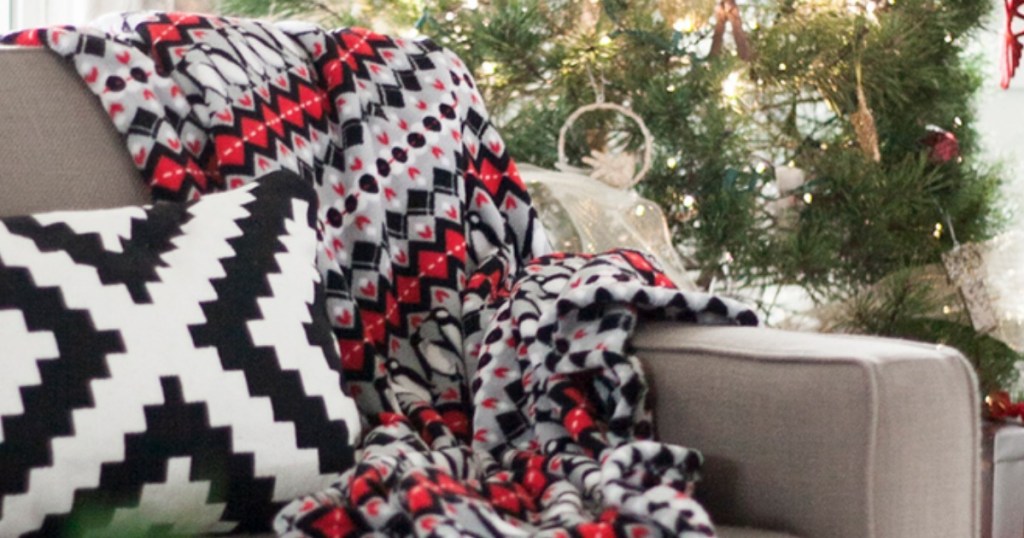 Vera Bradley throw blanket on the end of a couch