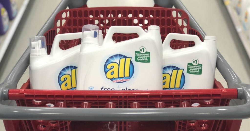 three bottles of laundry detergent in red cart 