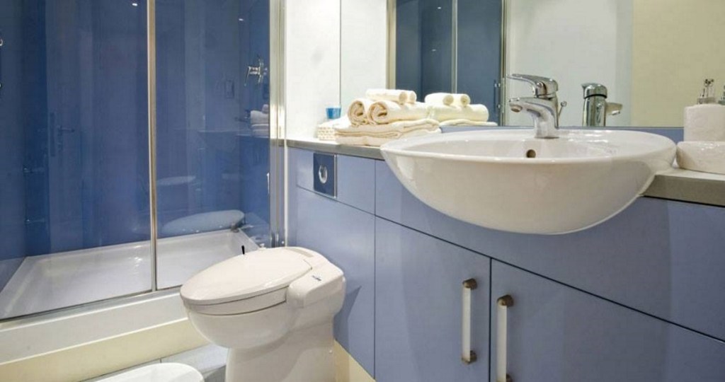 Biobidet installed on toilet in modern bathroom