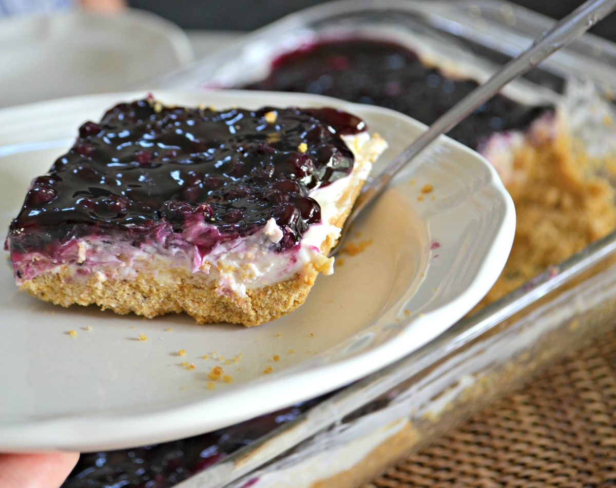 blueberry cheesecake squares on plate