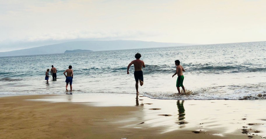 kids running on the beach