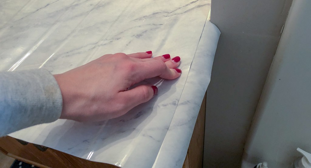 marble countertop DIY - cut small pieces to help cover edge to edge