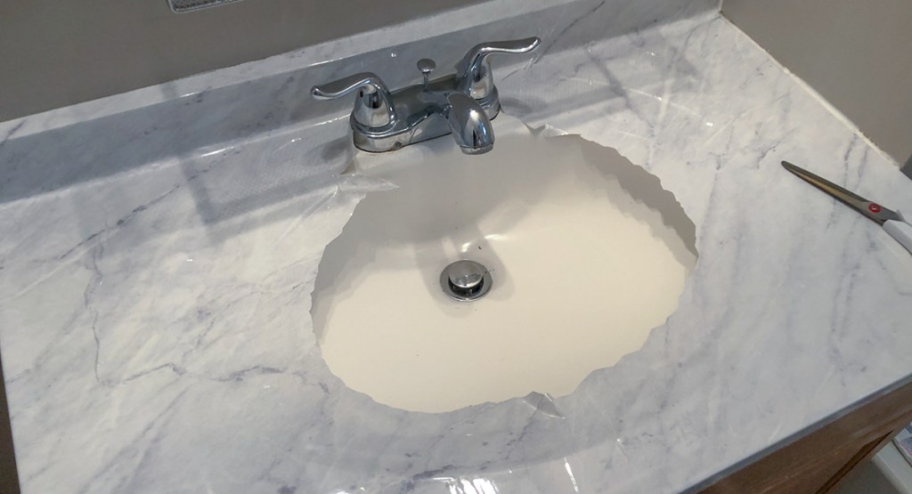 marble countertop DIY - cut into the center of basin and work out in circles