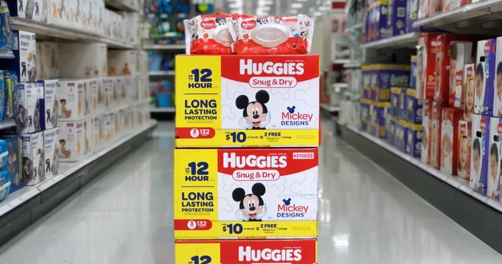 stack of Huggies diapers on floor