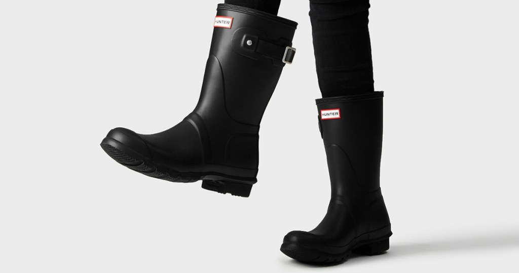 woman wearing black short hunter rain boots