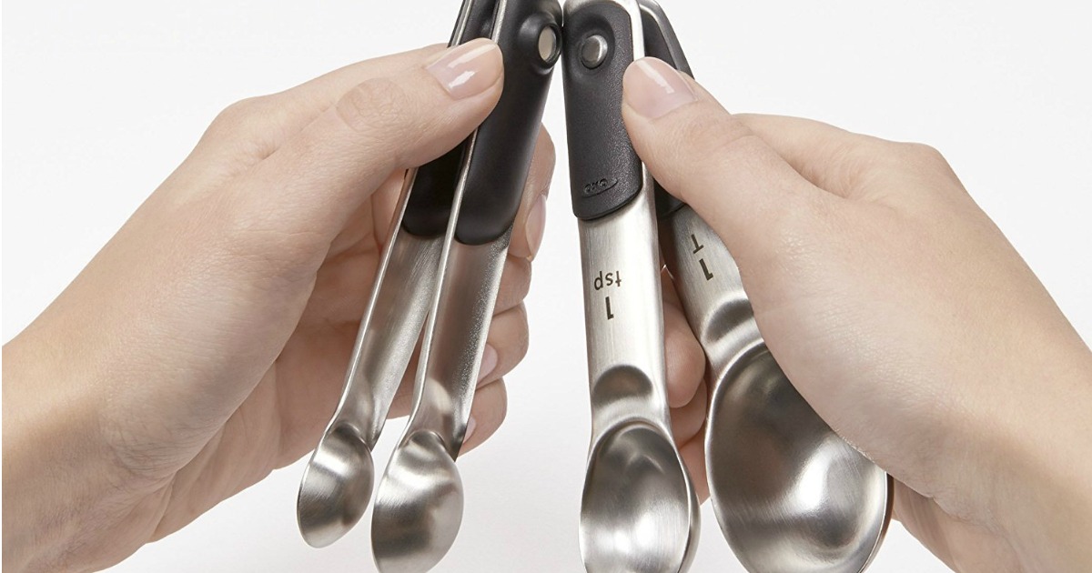 OXO Good Grips 4-piece magnetic measuring spoon set being held
