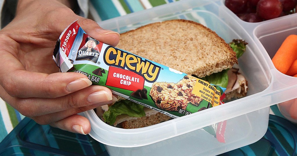 person pulling Chewy Chocolate Chip granola bar out of lunch container