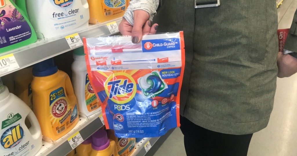 Woman holding Walgreens Tide Pods 