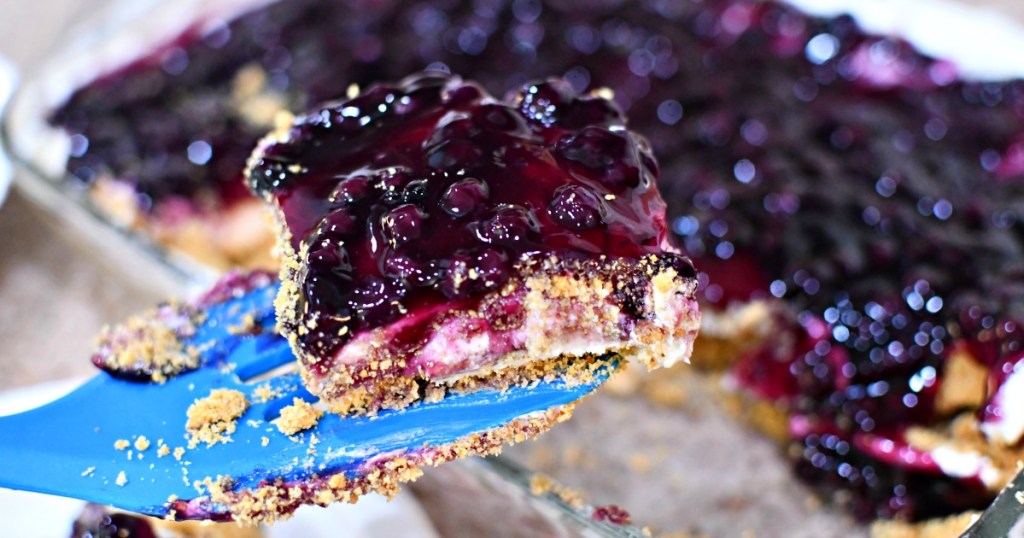 slice of blueberry cheesecake dessert on a spatula