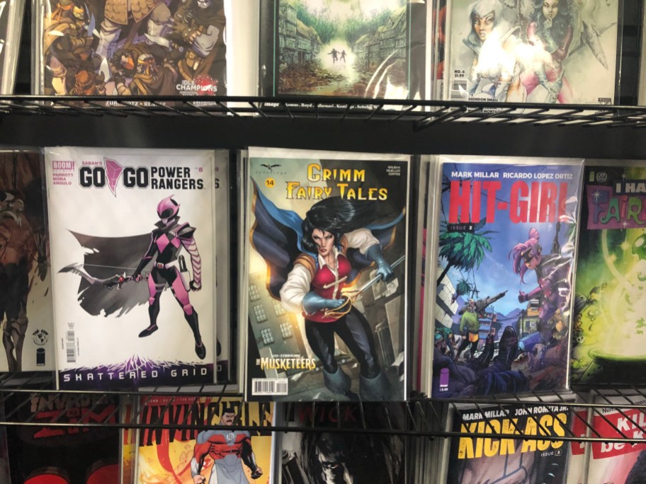 a rack of comics in a comic store