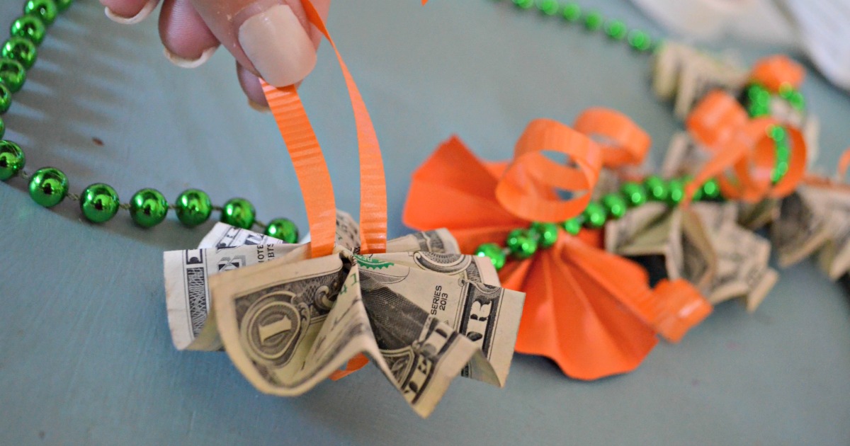 tying money to a graduation lei