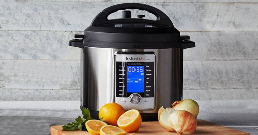 Instant Pot Ultra next to a cutting board with aromatics