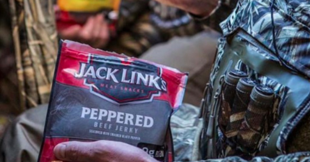 hand holding bag of Jack Link's beef jerky