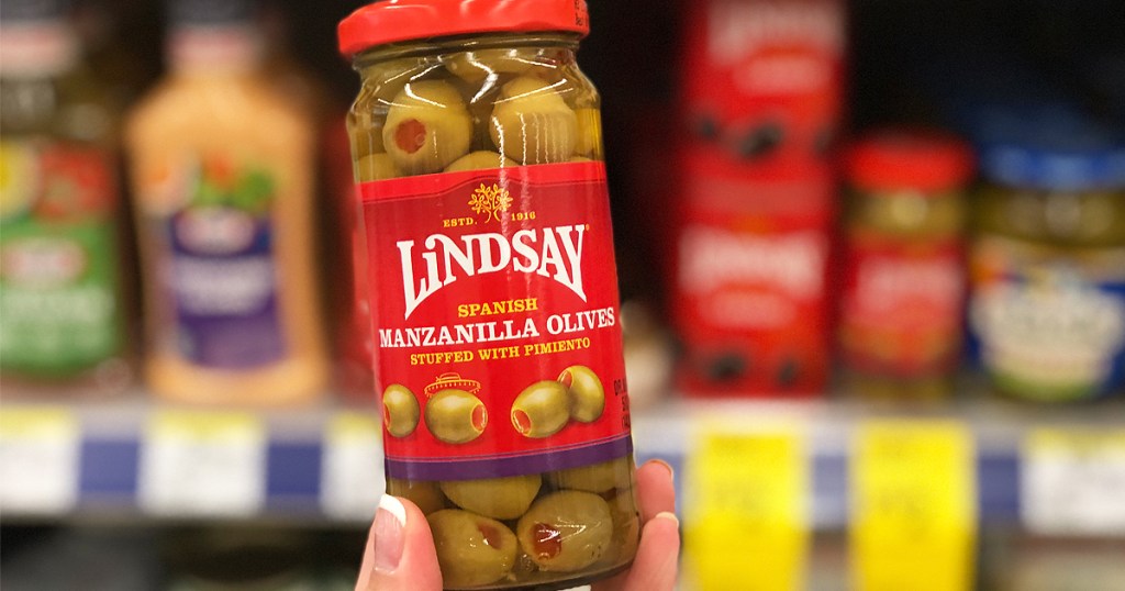hand holding Lindsay Olives in store