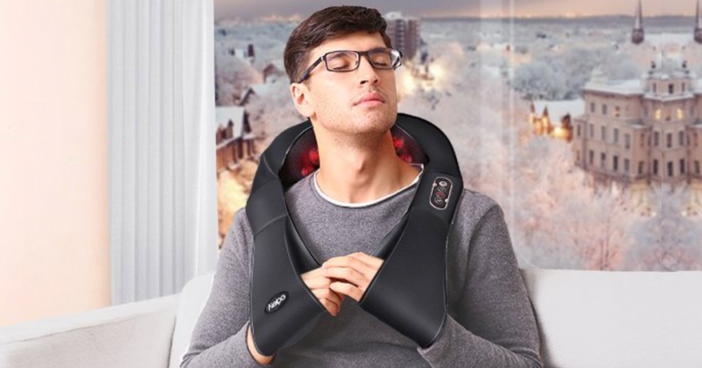 man sitting with back massager on
