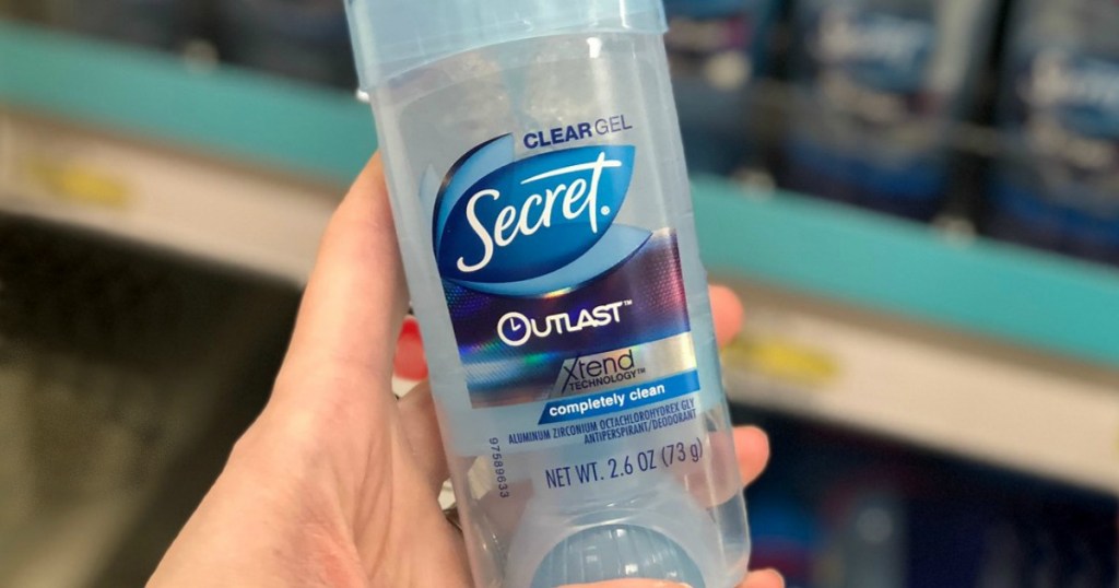 hand holding deodorant in store