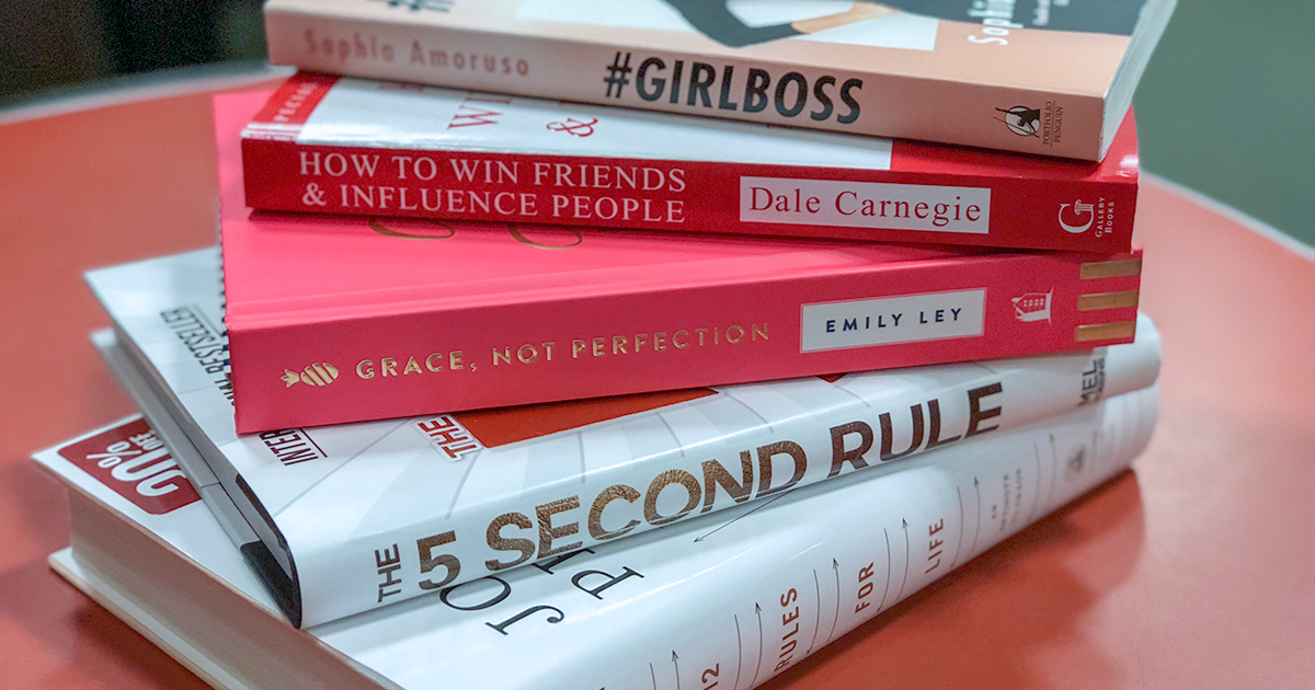 A stack of a few of the best self-help books on Amazon 