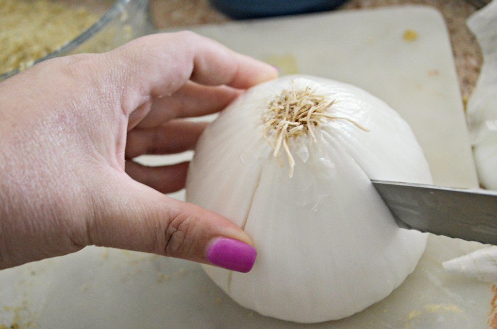 Best Air Fryer - knife slicing through an onion