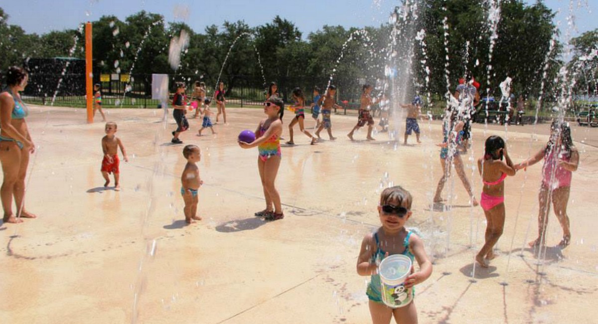 free summer activities for kids include outdoor activities like splash pads and pools like the one shown here