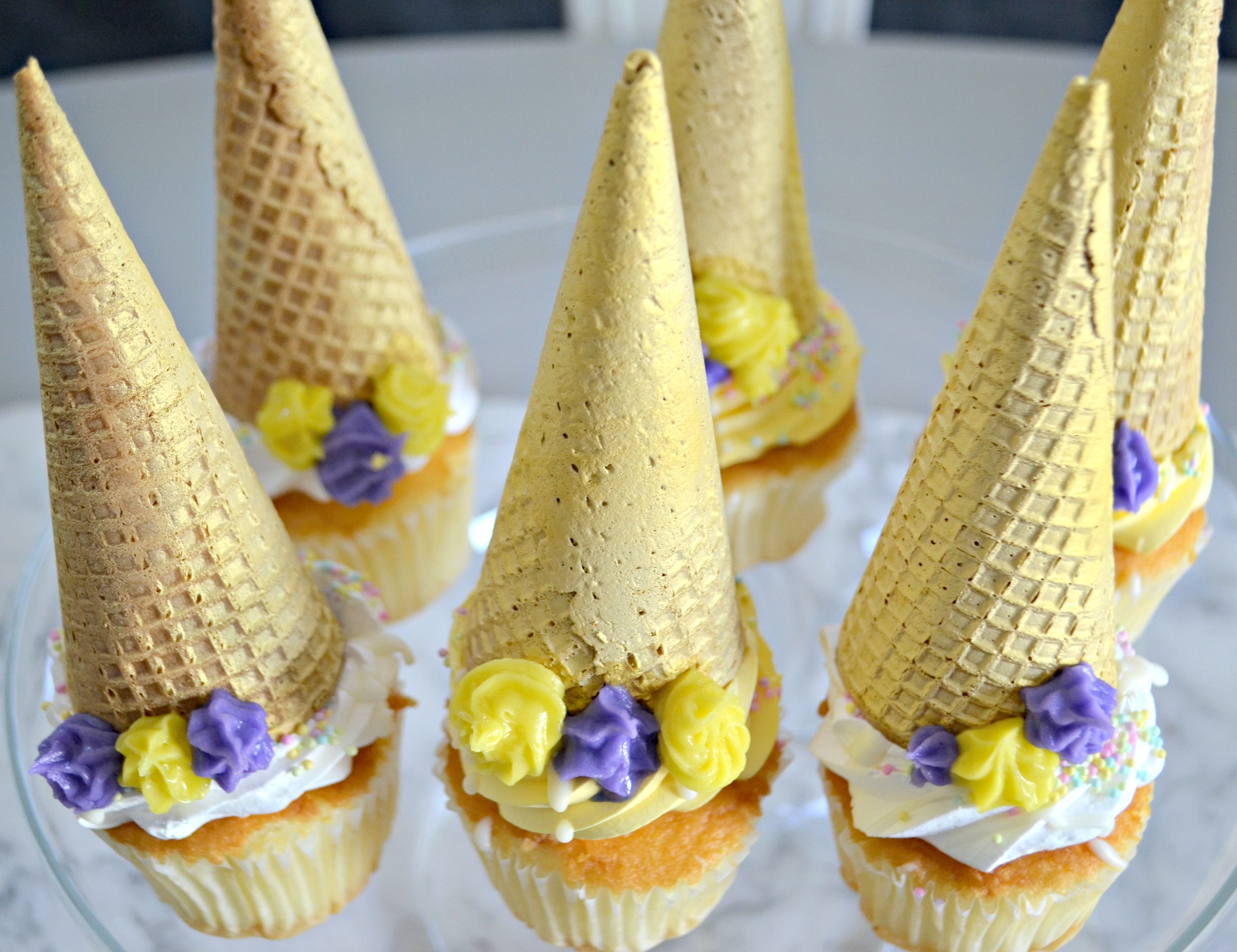ice cream cones on cupcakes with flower frosting
