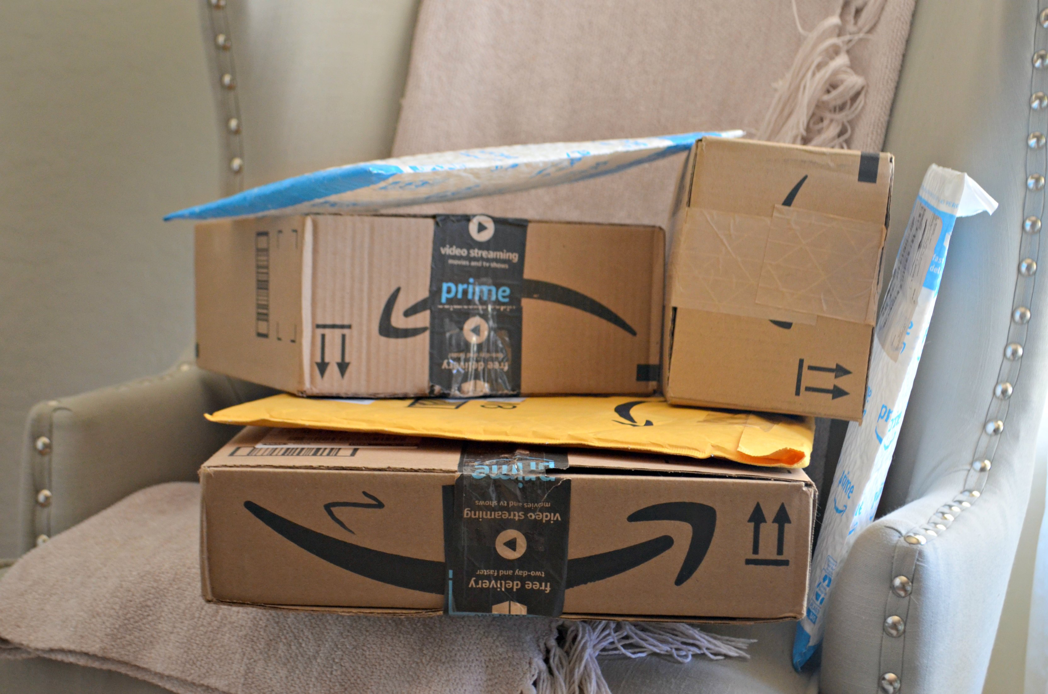 amazon prime day 2018 – packages stacked on a chair
