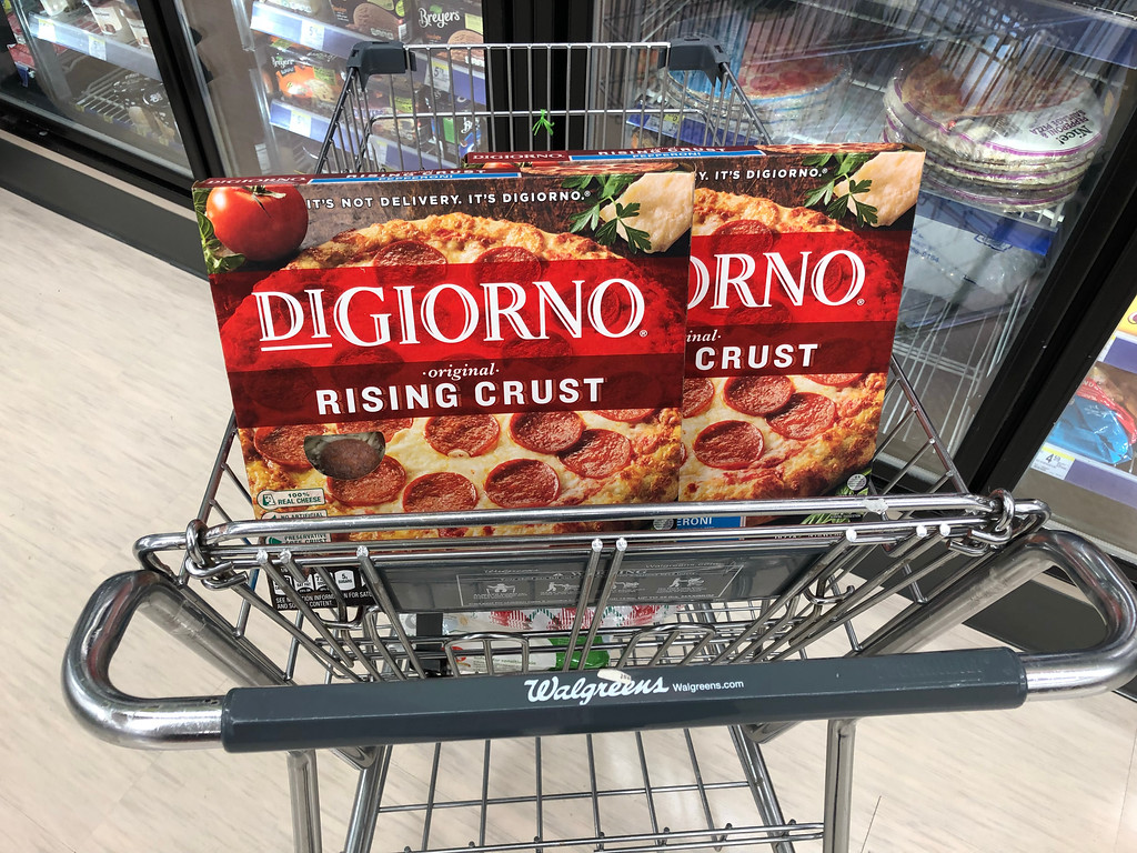 two boxes of pizza in cart 