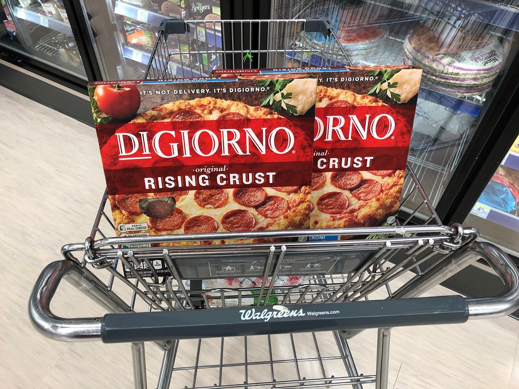 two boxes of pizza in cart