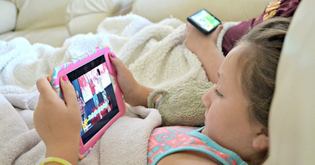 kids enjoying screen time on devices