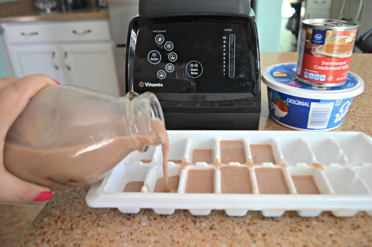 easy copycat Wendys frosty recipe – Pouring chocolate milk into an ice cube tray