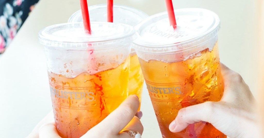 hands cheering with two cups of iced tea