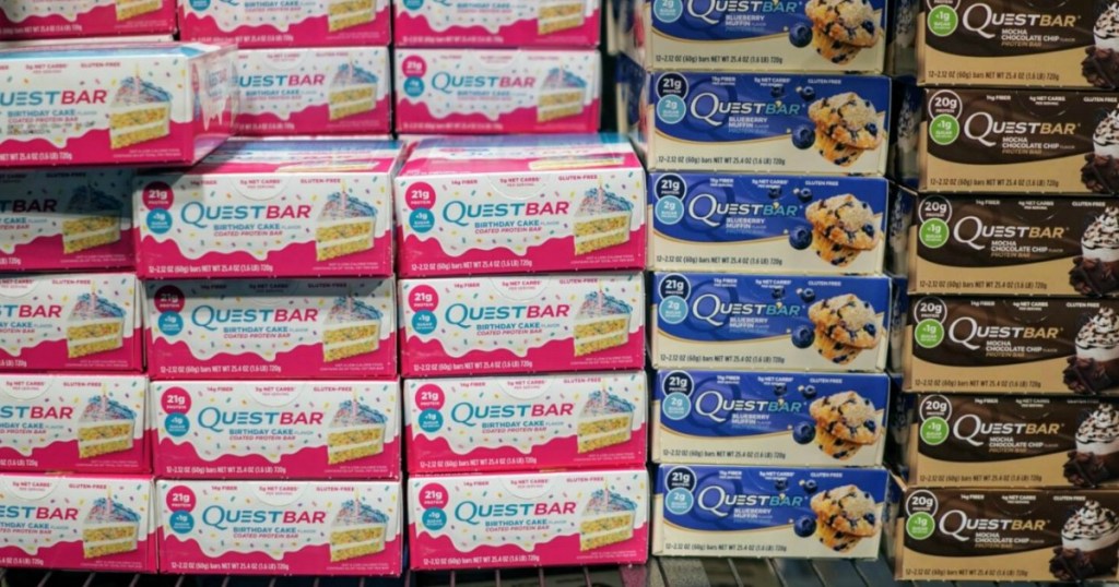 Shelf stocked full of Quest Barsin different flavors