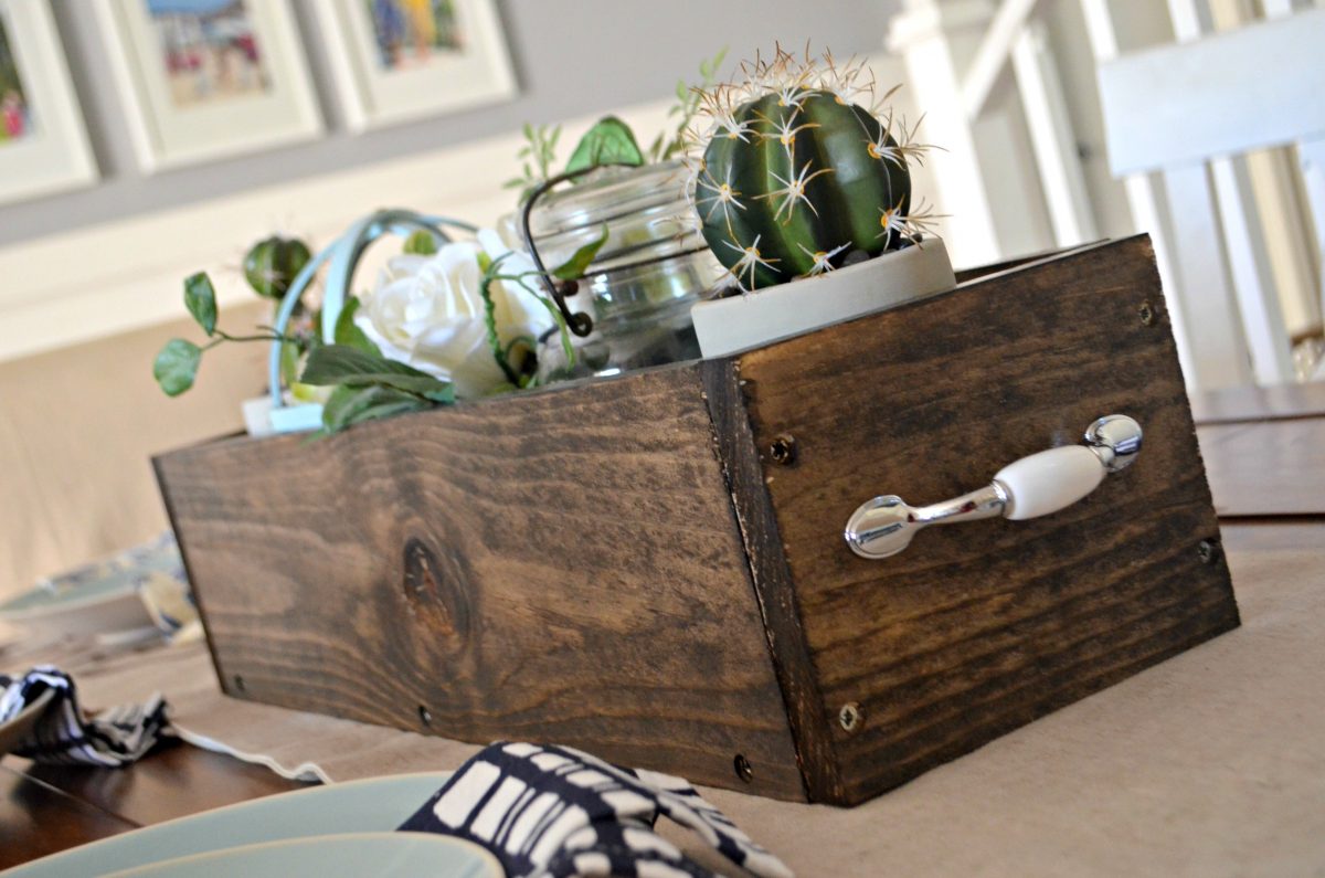 diy rustic farmhouse wood box centerpiece – decorated with a cactus, flowers, and a candle