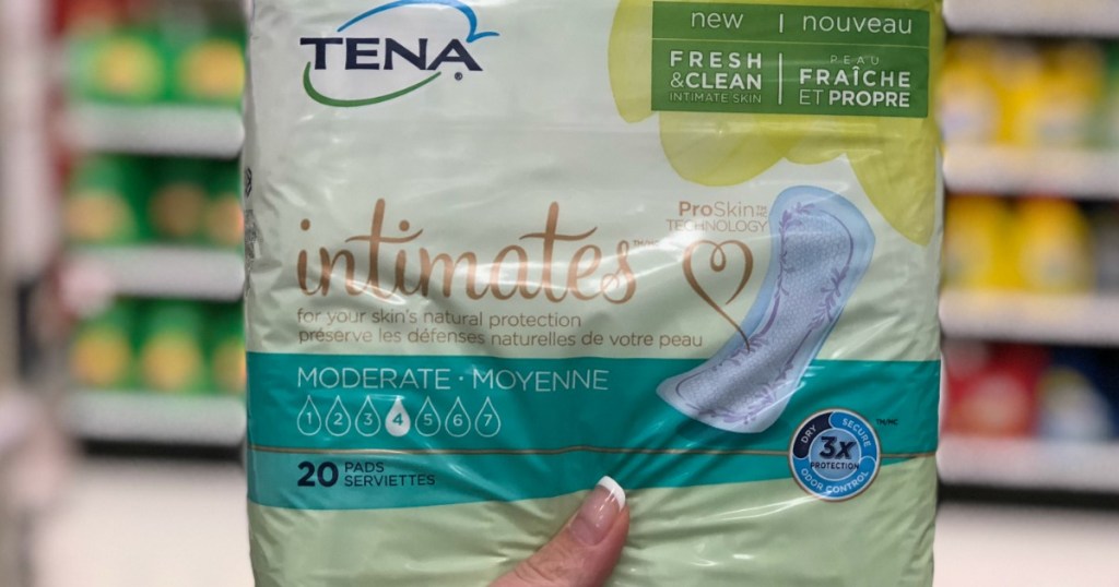 hand holding tena intimates product