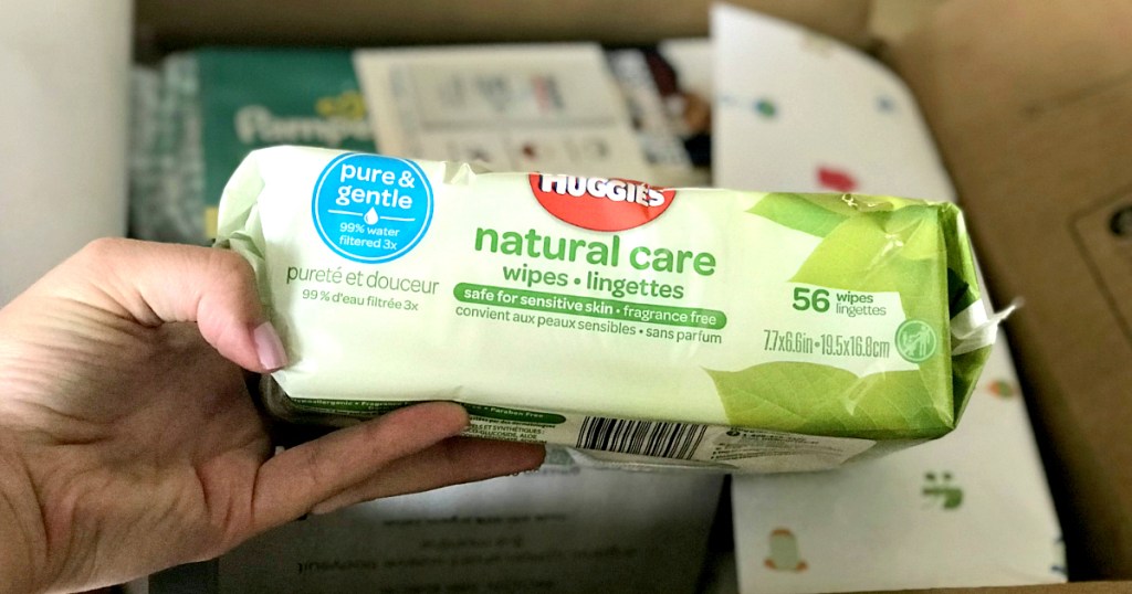 hand holding package of Huggies baby wipes
