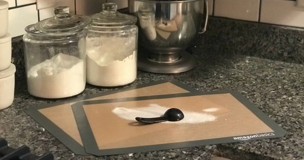 baking sheets on counter with measuring spoon