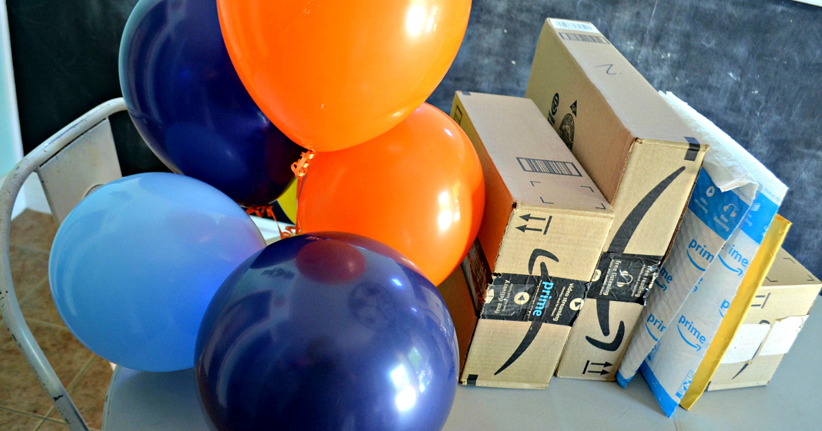 win a membership just in time for amazon prime day - balloons and Amazon boxes