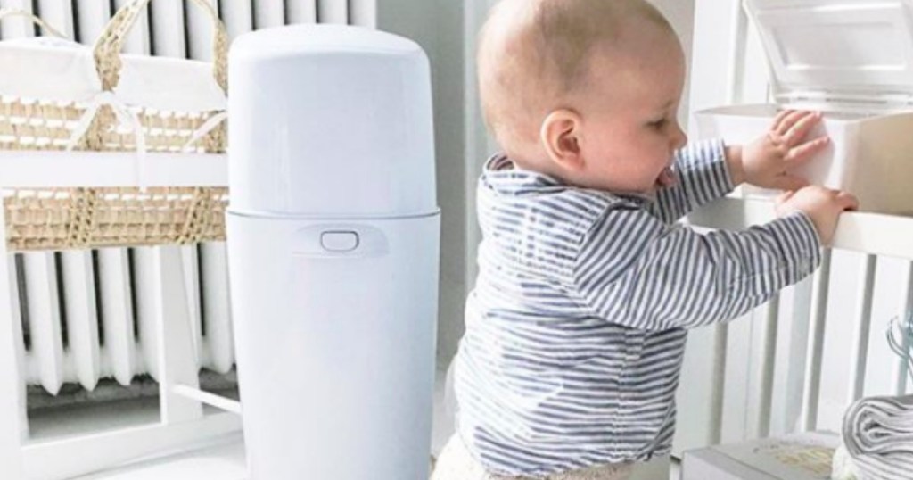 diaper genie in nursery with baby