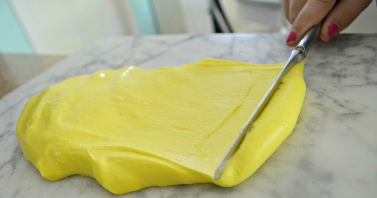 butter slime being spread with a knife